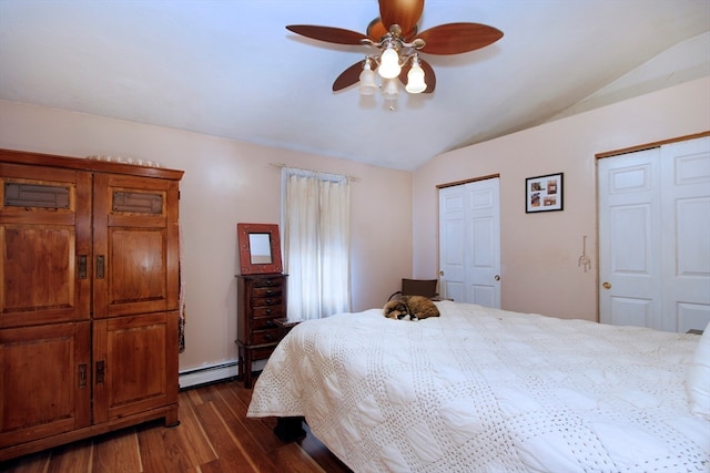 bedroom with ceiling fan, dark wood-type flooring, a baseboard radiator, and vaulted ceiling