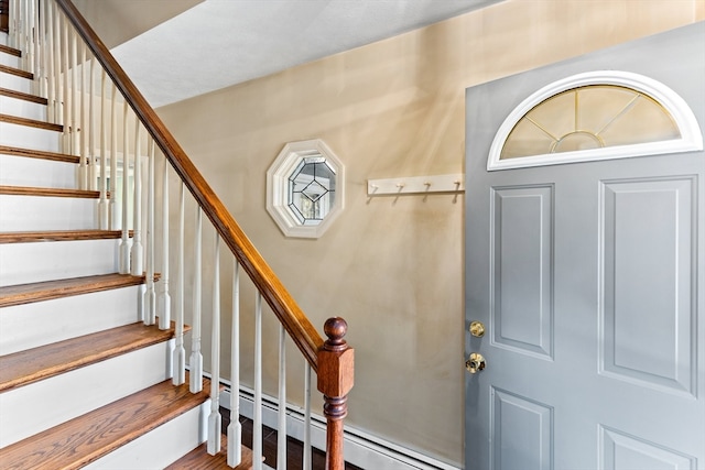 entryway with baseboard heating and hardwood / wood-style flooring