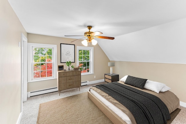 bedroom with baseboard heating, lofted ceiling, light colored carpet, and ceiling fan