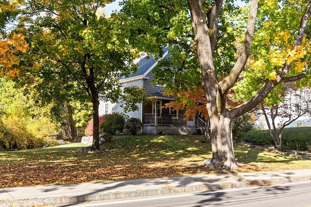 obstructed view of property featuring covered porch