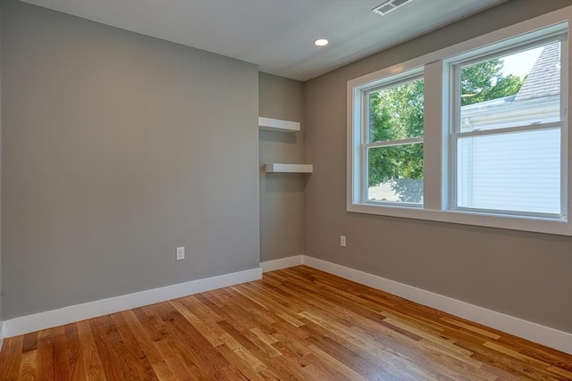 238 Sycamore St Unit 238, Watertown, MA 02472 - unfurnished room with baseboards, wood finished floors, and recessed lighting