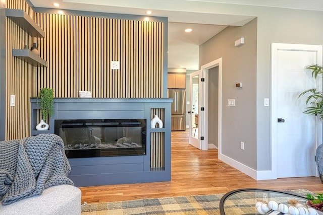 238 Sycamore St Unit 238, Watertown, MA 02472 - living area with baseboards, wood finished floors, a glass covered fireplace, and recessed lighting
