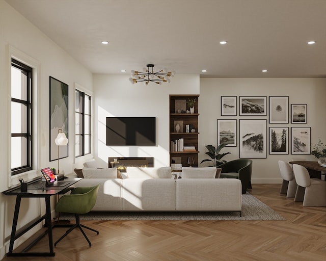 living room with a chandelier and light parquet floors