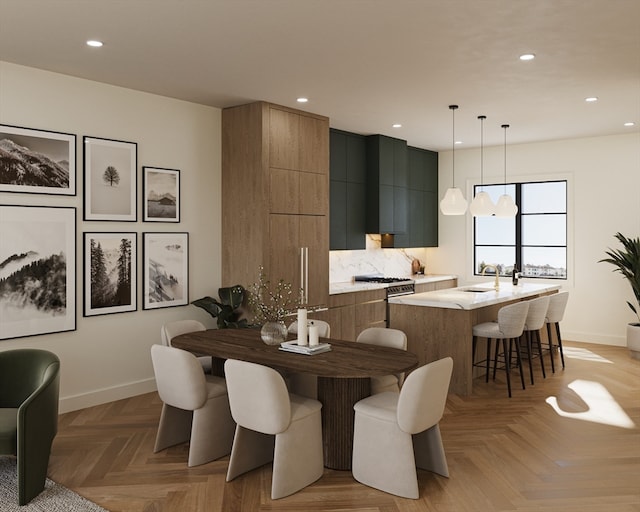 dining room featuring light parquet flooring and sink