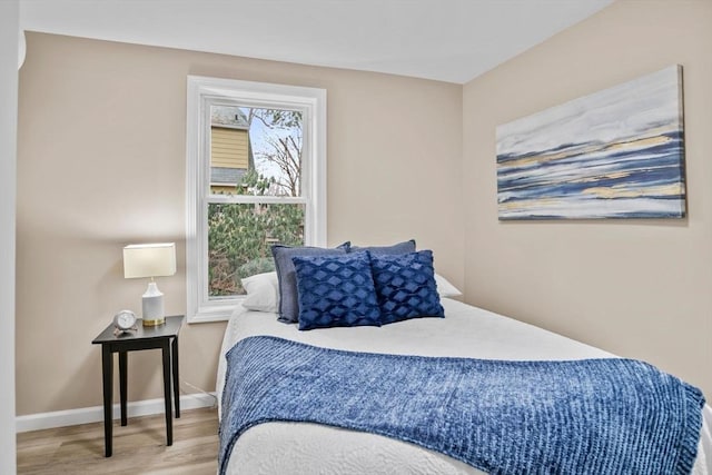 bedroom with light wood-type flooring