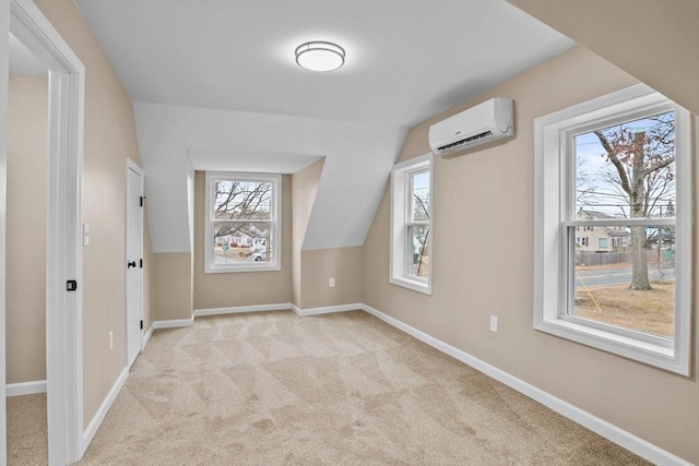 bonus room with light carpet, vaulted ceiling, and a wall mounted AC