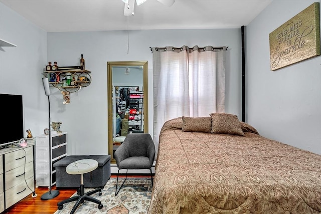 bedroom with wood finished floors