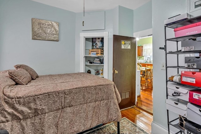 bedroom featuring wood finished floors