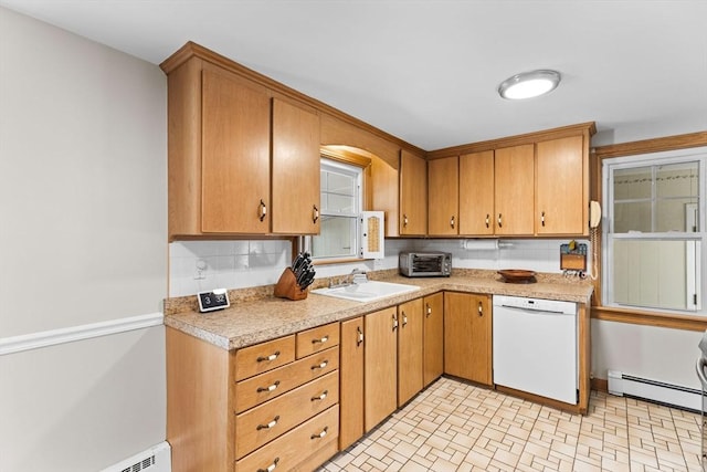 kitchen with a sink, a baseboard heating unit, light countertops, baseboard heating, and dishwasher