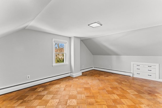 bonus room with baseboards, a baseboard heating unit, and lofted ceiling