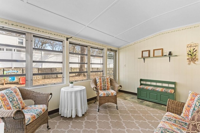 sunroom / solarium featuring vaulted ceiling