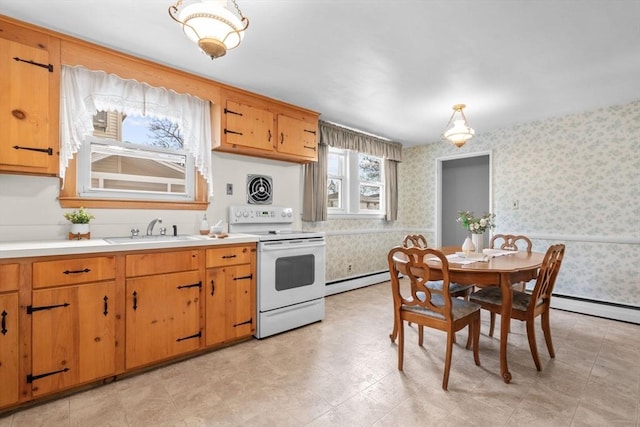 kitchen featuring sink, baseboard heating, hanging light fixtures, and white electric range oven