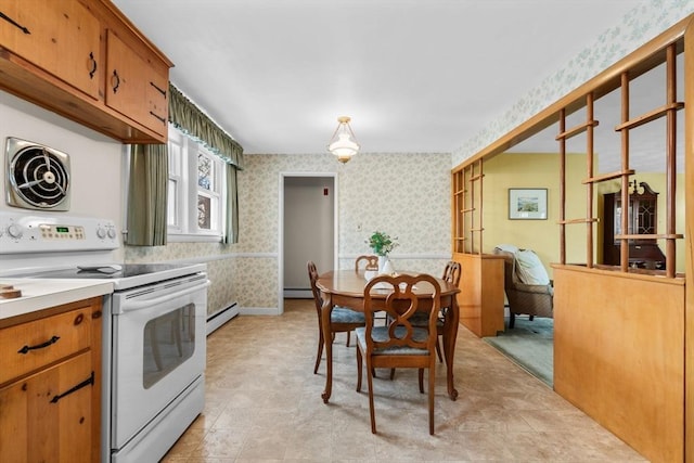 kitchen featuring a baseboard heating unit and electric stove