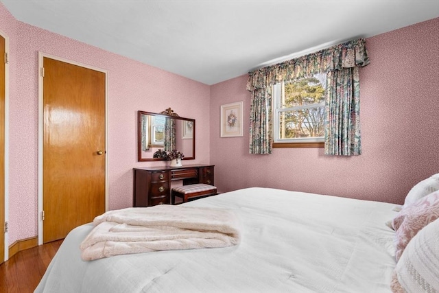 bedroom with hardwood / wood-style flooring