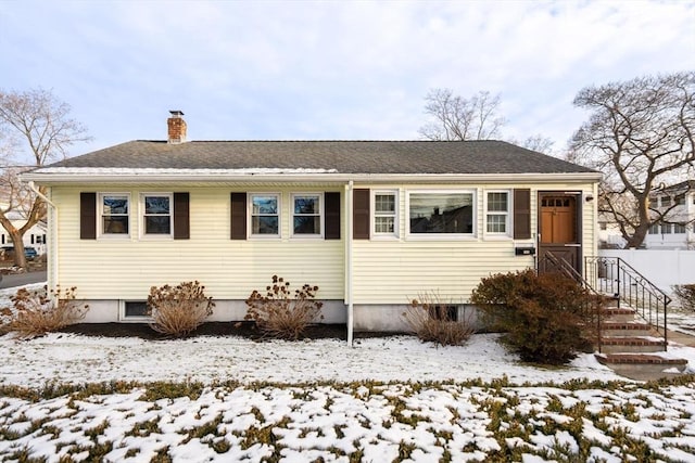 view of snow covered house