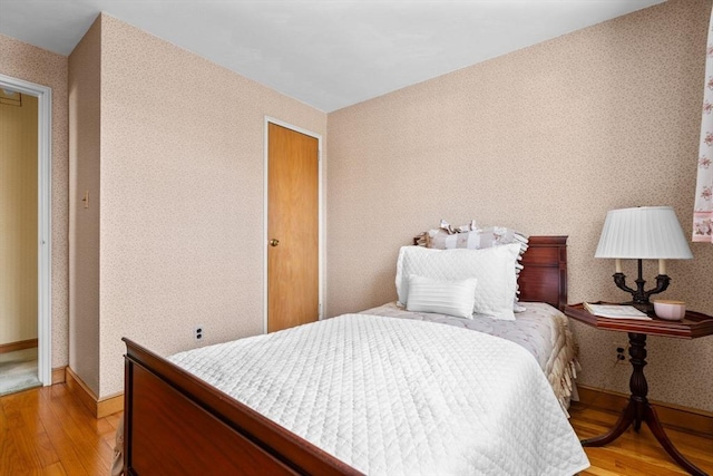 bedroom featuring a closet and light hardwood / wood-style flooring