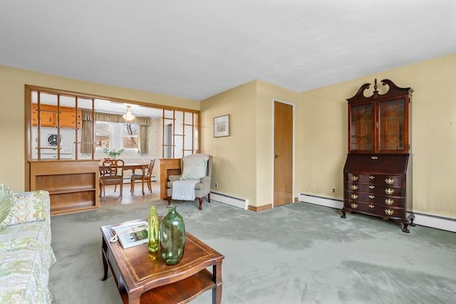 living room with baseboard heating and carpet flooring