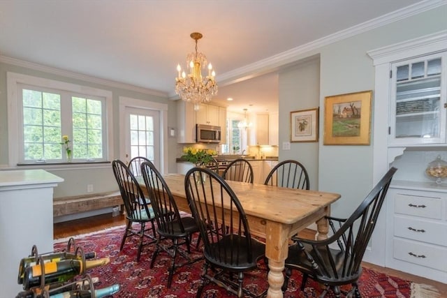6 Willow St, Wellesley, MA 02481 - dining room featuring a chandelier, wood finished floors, and ornamental molding