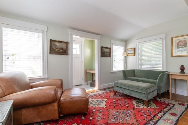 6 Willow St, Wellesley, MA 02481 - living room featuring vaulted ceiling, healthy amount of natural light, wood finished floors, and baseboards