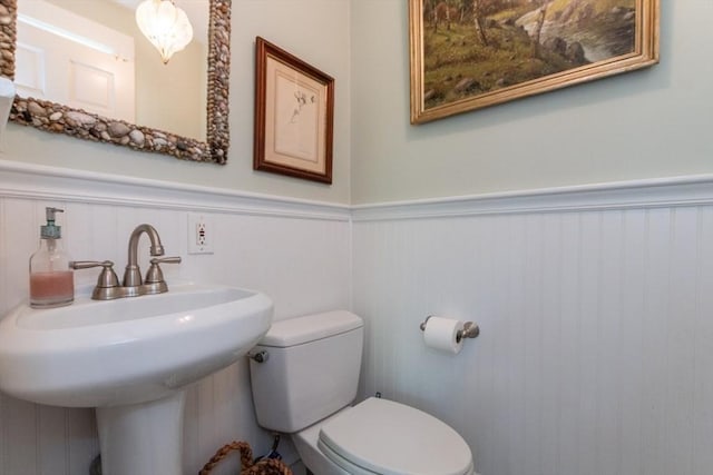 6 Willow St, Wellesley, MA 02481 - half bath featuring wainscoting, toilet, and a sink