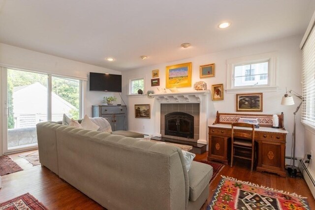 6 Willow St, Wellesley, MA 02481 - living area featuring a tile fireplace, plenty of natural light, dark wood-style flooring, a baseboard heating unit, and recessed lighting