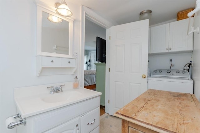 6 Willow St, Wellesley, MA 02481 - ensuite bathroom with washer / dryer and vanity