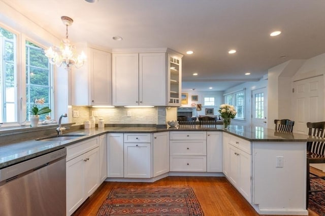 6 Willow St, Wellesley, MA 02481 - kitchen with dishwasher, a sink, a peninsula, white cabinets, and a chandelier