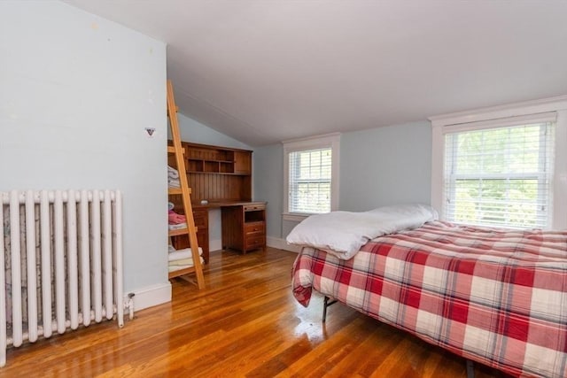 6 Willow St, Wellesley, MA 02481 - bedroom featuring radiator, wood finished floors, lofted ceiling, and baseboards