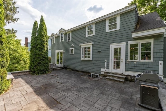 6 Willow St, Wellesley, MA 02481 - back of property with entry steps and a patio area