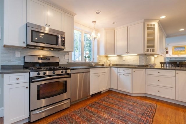 6 Willow St, Wellesley, MA 02481 - kitchen with stainless steel appliances, a chandelier, white cabinets, and recessed lighting