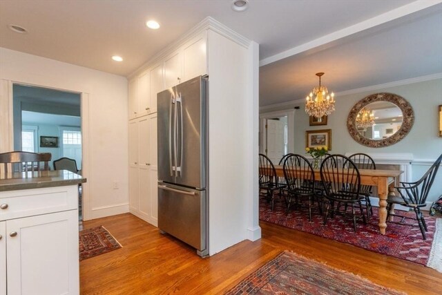 6 Willow St, Wellesley, MA 02481 - kitchen featuring freestanding refrigerator, white cabinets, light wood-style flooring, a chandelier, and recessed lighting