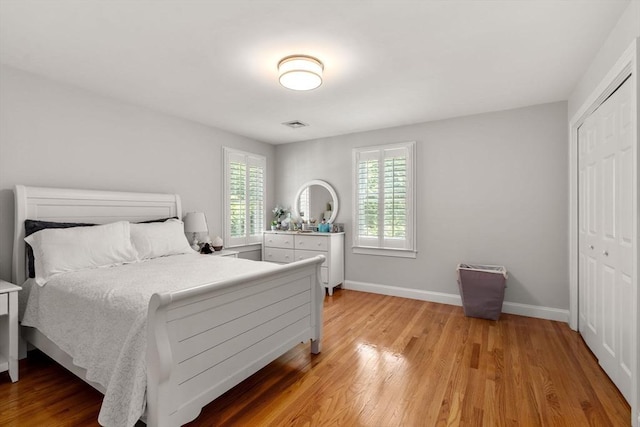 127 Shade St, Lexington, MA 02421 - bedroom with light wood-style flooring, a closet, and baseboards