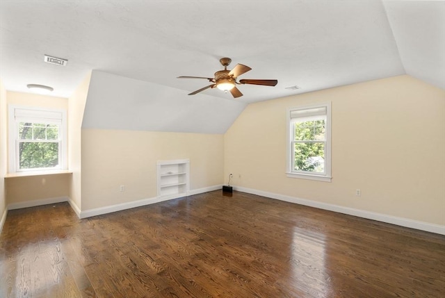 127 Shade St, Lexington, MA 02421 - bonus room featuring built in shelves, vaulted ceiling, a ceiling fan, baseboards, and wood finished floors
