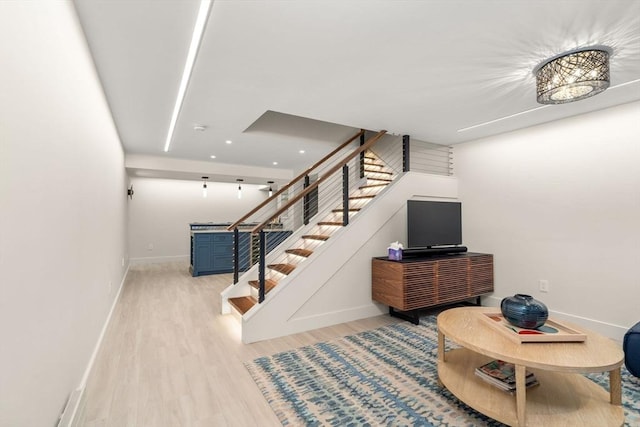 127 Shade St, Lexington, MA 02421 - stairs featuring wood finished floors, baseboards, and recessed lighting
