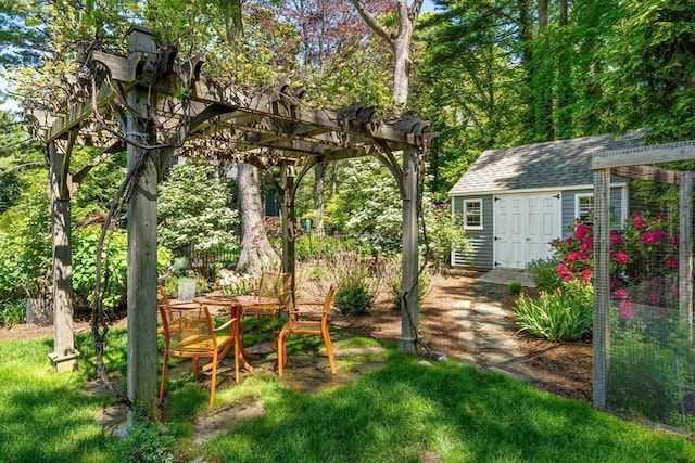 127 Shade St, Lexington, MA 02421 - view of yard featuring a pergola and an outbuilding