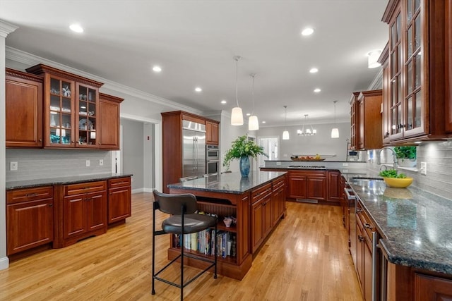 127 Shade St, Lexington, MA 02421 - kitchen with a sink, stainless steel built in fridge, a peninsula, light wood finished floors, and tasteful backsplash