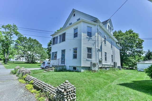 18 Emerald Ave, Webster, MA 01570 - view of home's exterior featuring a lawn