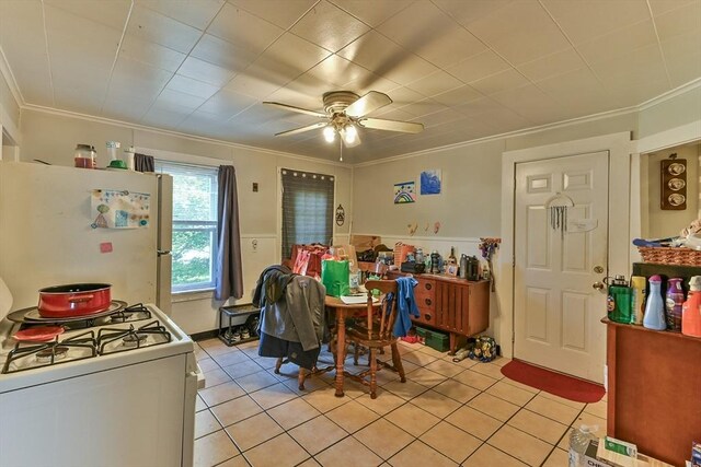 18 Emerald Ave, Webster, MA 01570 - dining space featuring light tile patterned floors, ornamental molding, and a ceiling fan