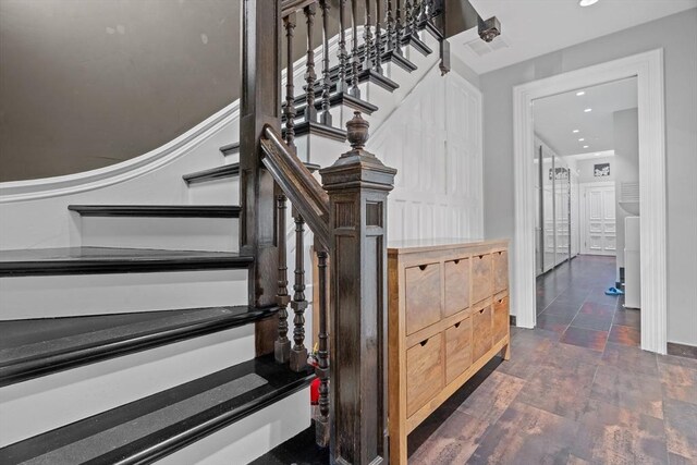 stairway featuring recessed lighting and wood finished floors