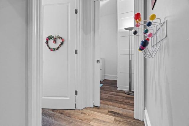 corridor featuring wood finished floors