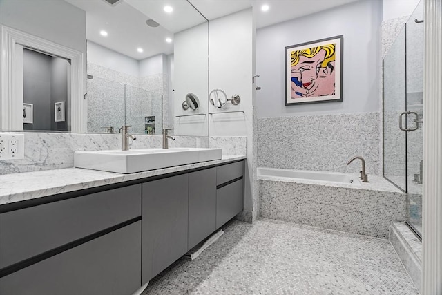 bathroom featuring vanity, a stall shower, recessed lighting, and a bath