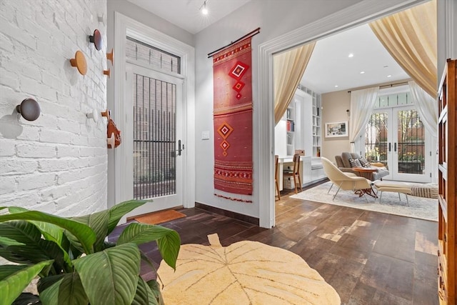 foyer entrance featuring french doors and dark wood finished floors