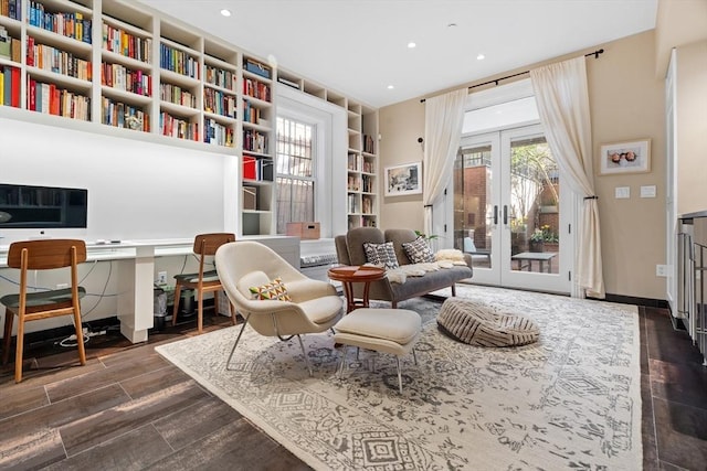 living area featuring french doors, recessed lighting, and built in shelves