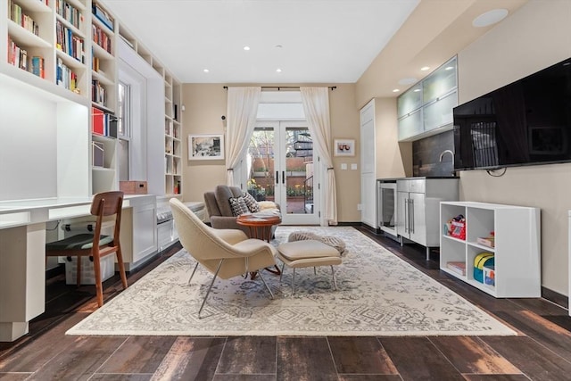 living area with built in study area, french doors, recessed lighting, wine cooler, and dark wood-type flooring