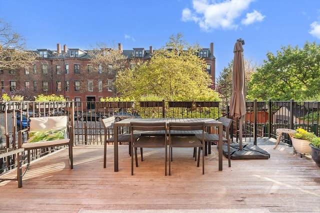 wooden terrace with outdoor dining area