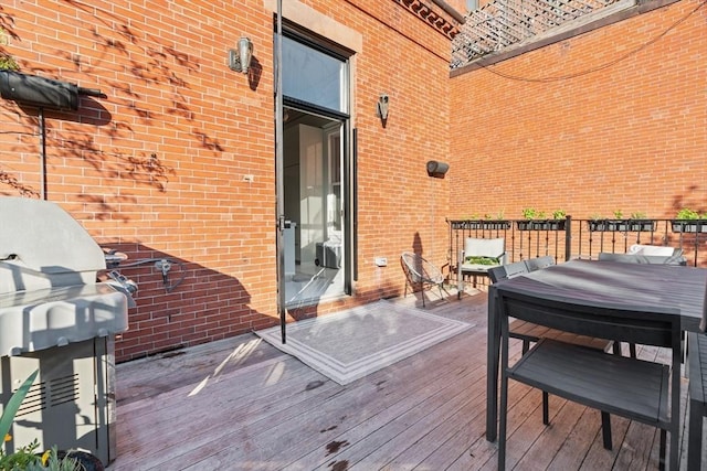 wooden deck featuring area for grilling