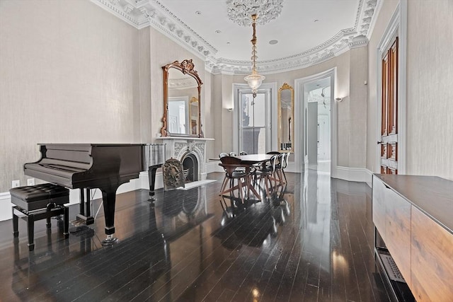 dining area with crown molding and wood-type flooring