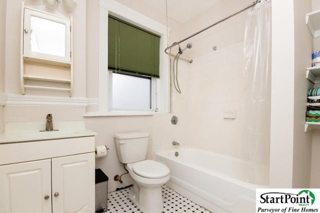 bathroom featuring vanity, toilet, and shower / tub combo with curtain