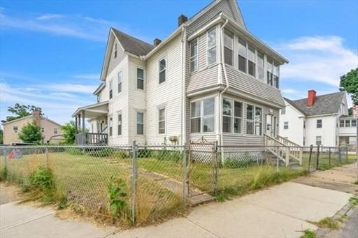 view of property exterior with a lawn