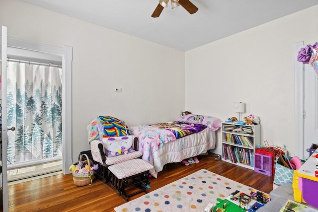 bedroom featuring wood finished floors and a ceiling fan